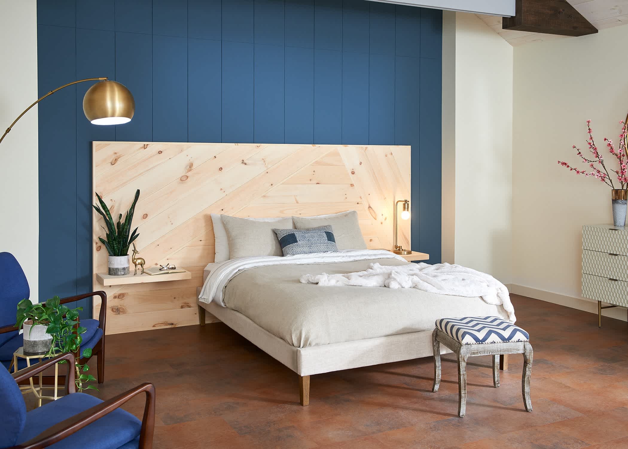 primary bedroom headboard and floating shelves built using unfinished solid hardwood flooring