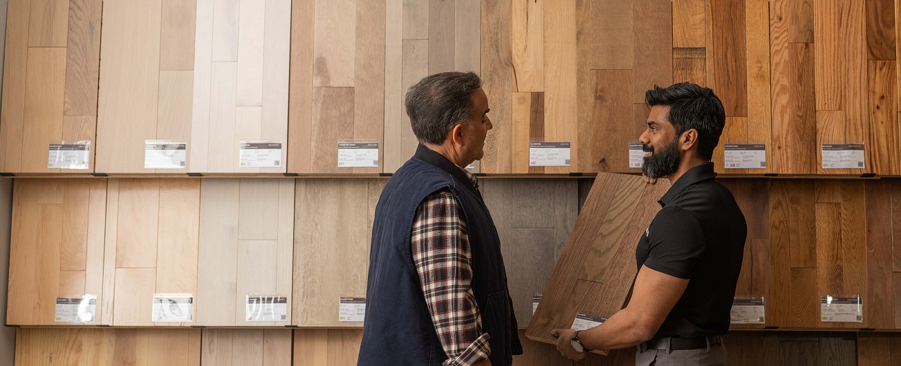 two men in store discussing flooring options