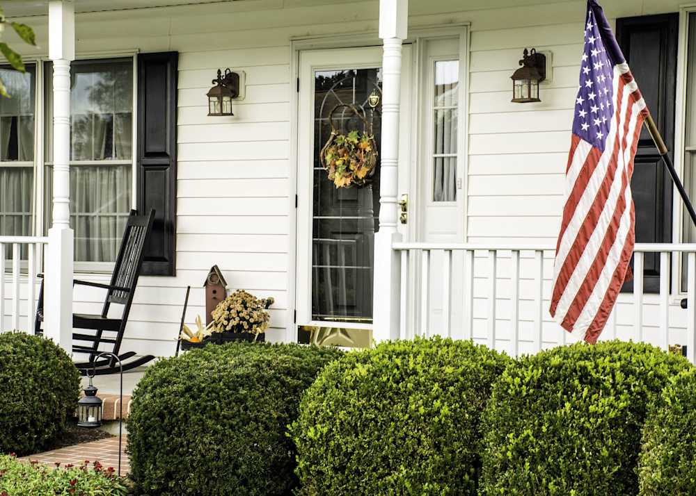 white porch with american flag
