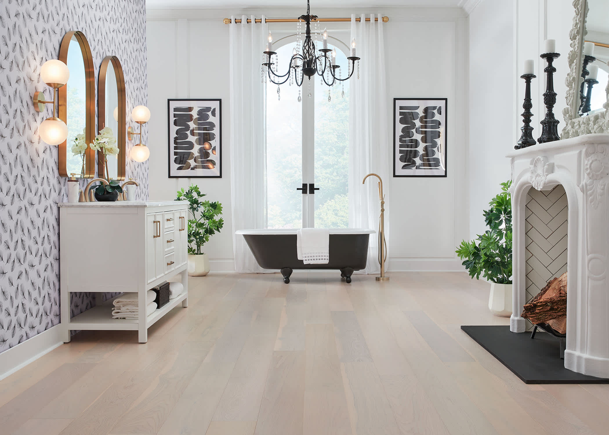 7mm+pad x 7.5 in. Great Plains Oak Water-resistant Engineered Hardwood Flooring in bathroom with black clawfoot tub with black chandelier and white ornate fireplace and black and white wallpaper
