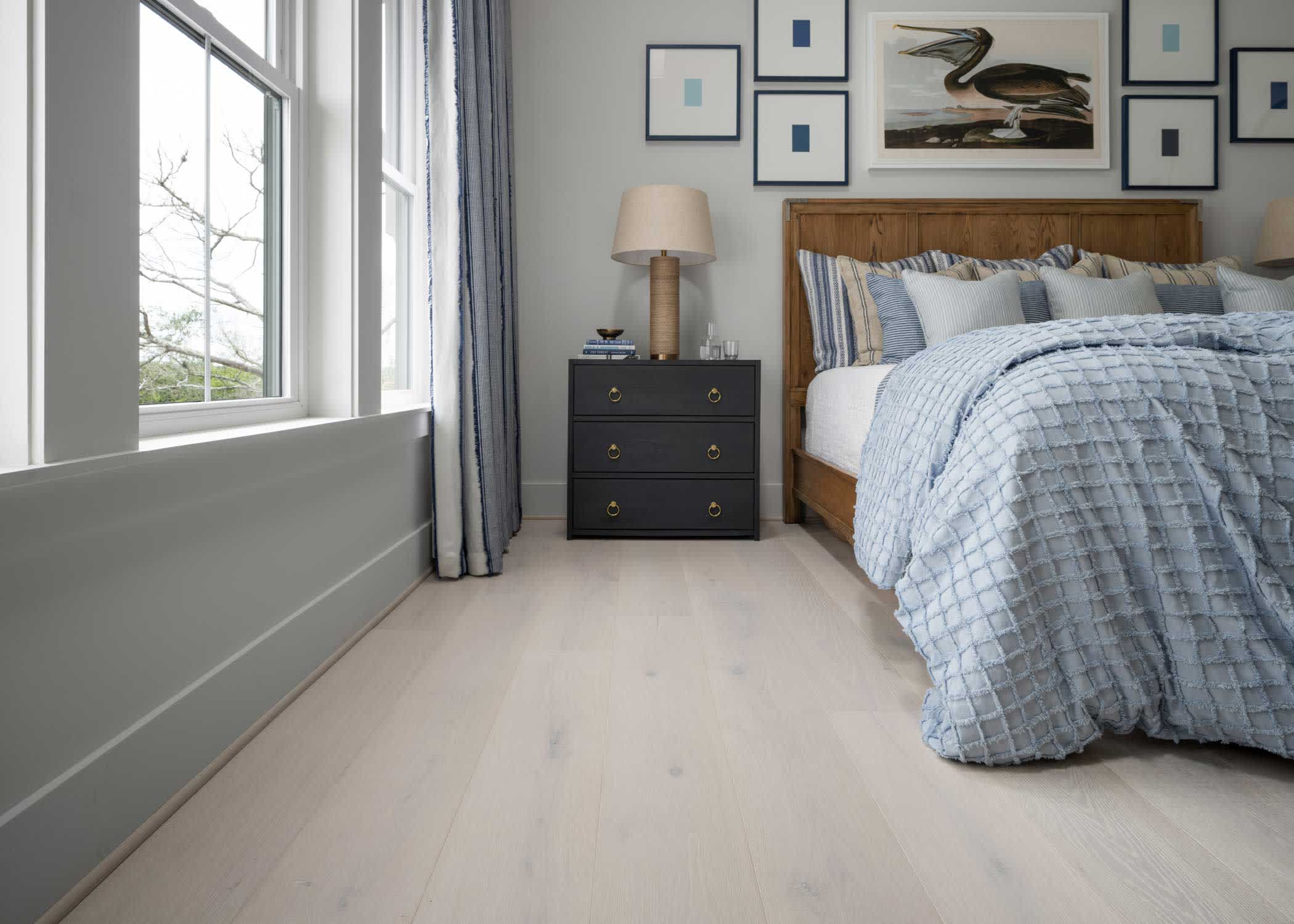 hgtv dream home 2024 living room with clearwater beach white oak engineered hardwood floors in bedroom with light blue bedding and dark blue nightstand