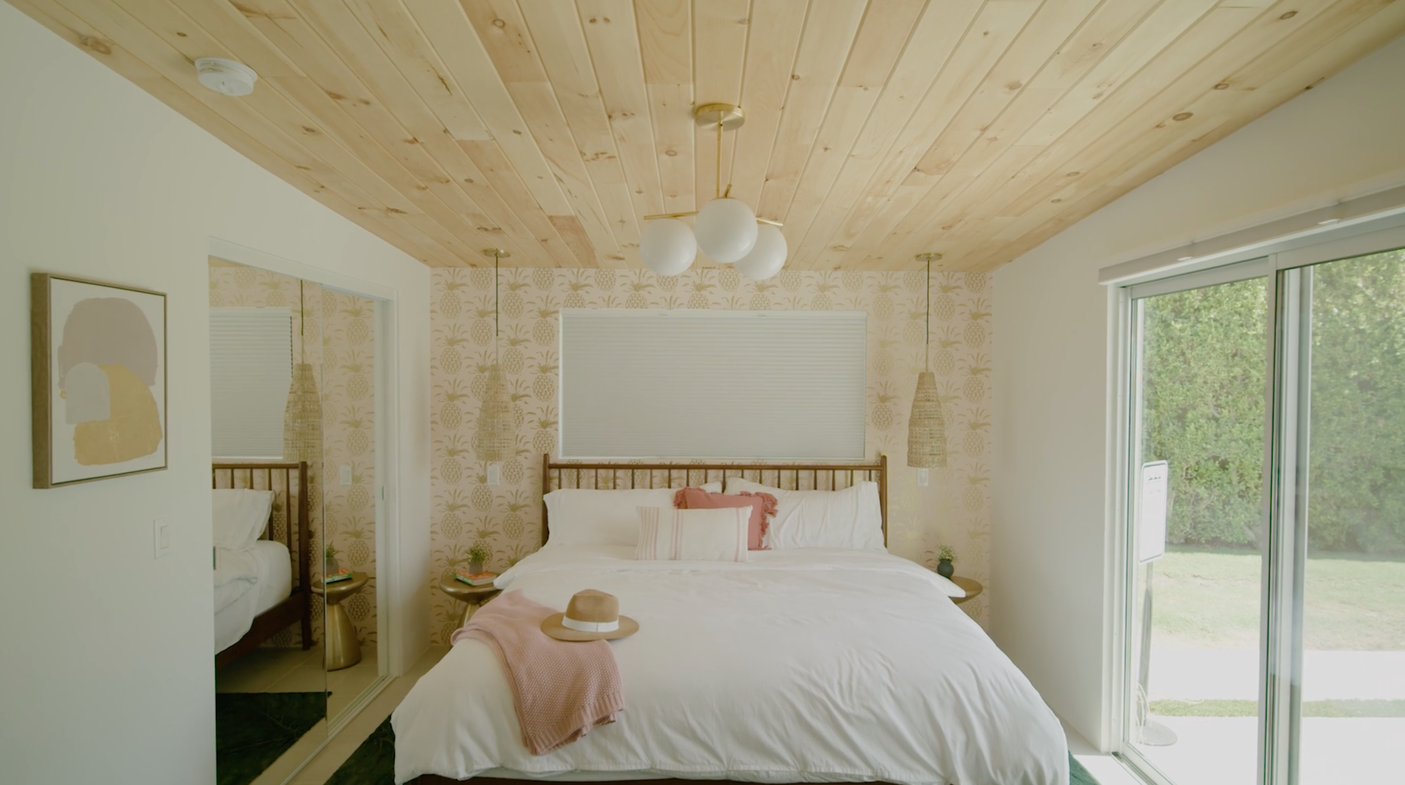 image of a bedroom with wood on ceiling