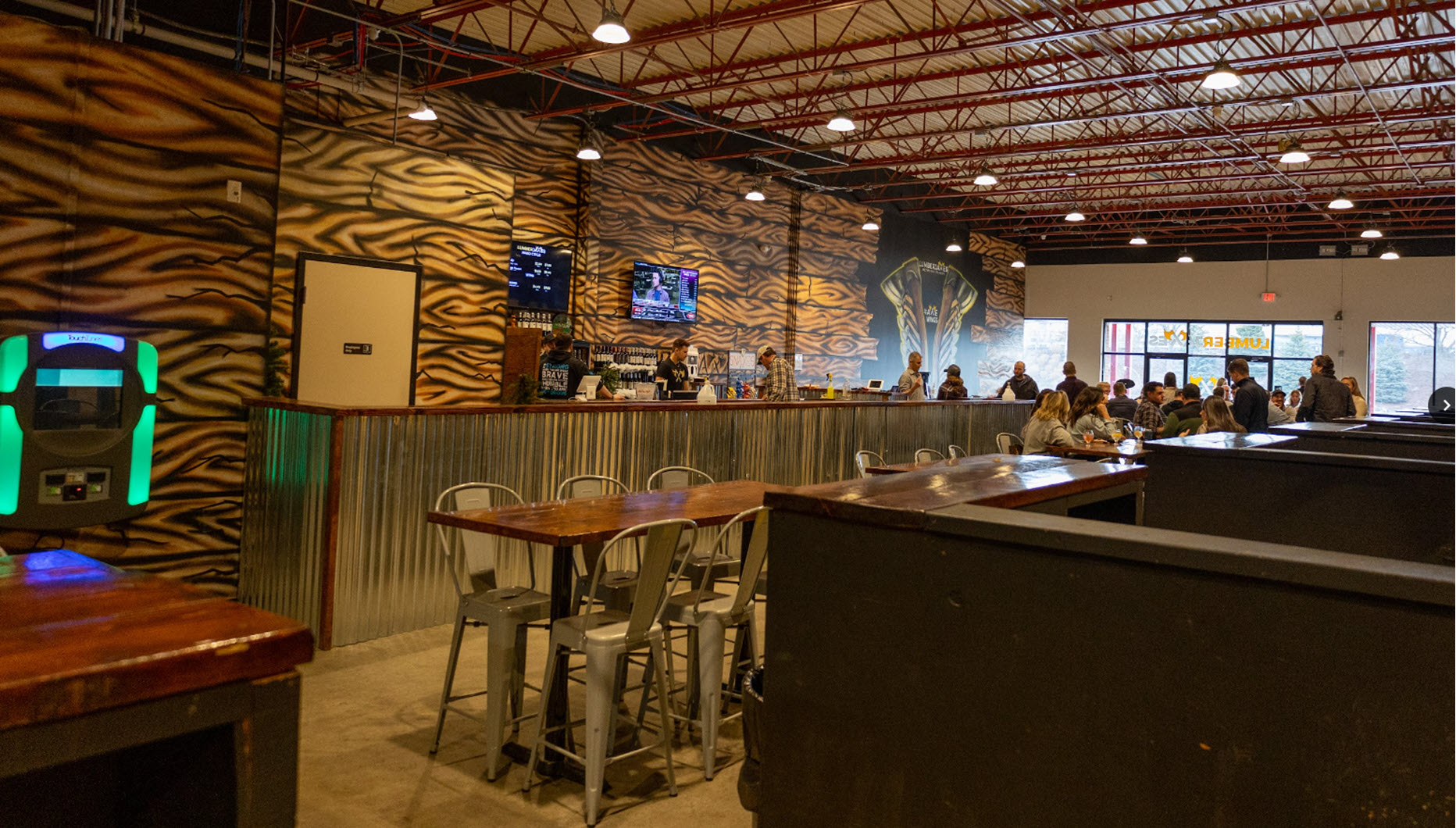 the large bar and banquet area of Lumberjaxes axe throwing venue