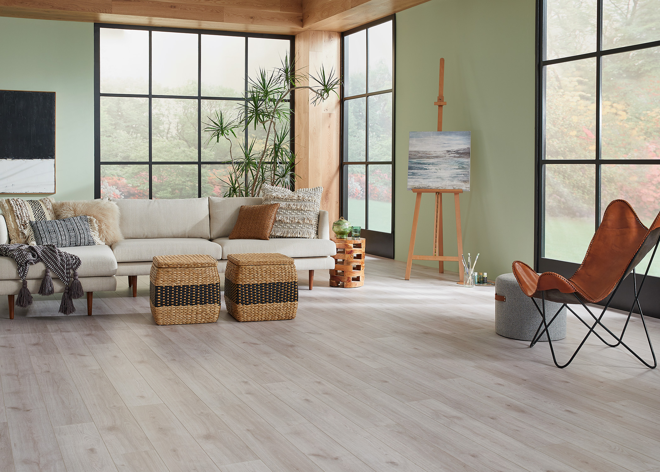 living room with art easel and waterproof vinyl flooring