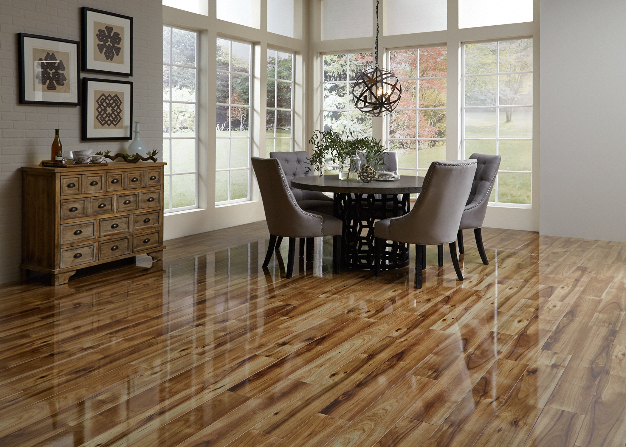 dining room with glossy hardwood look laminate flooring from LL Flooring