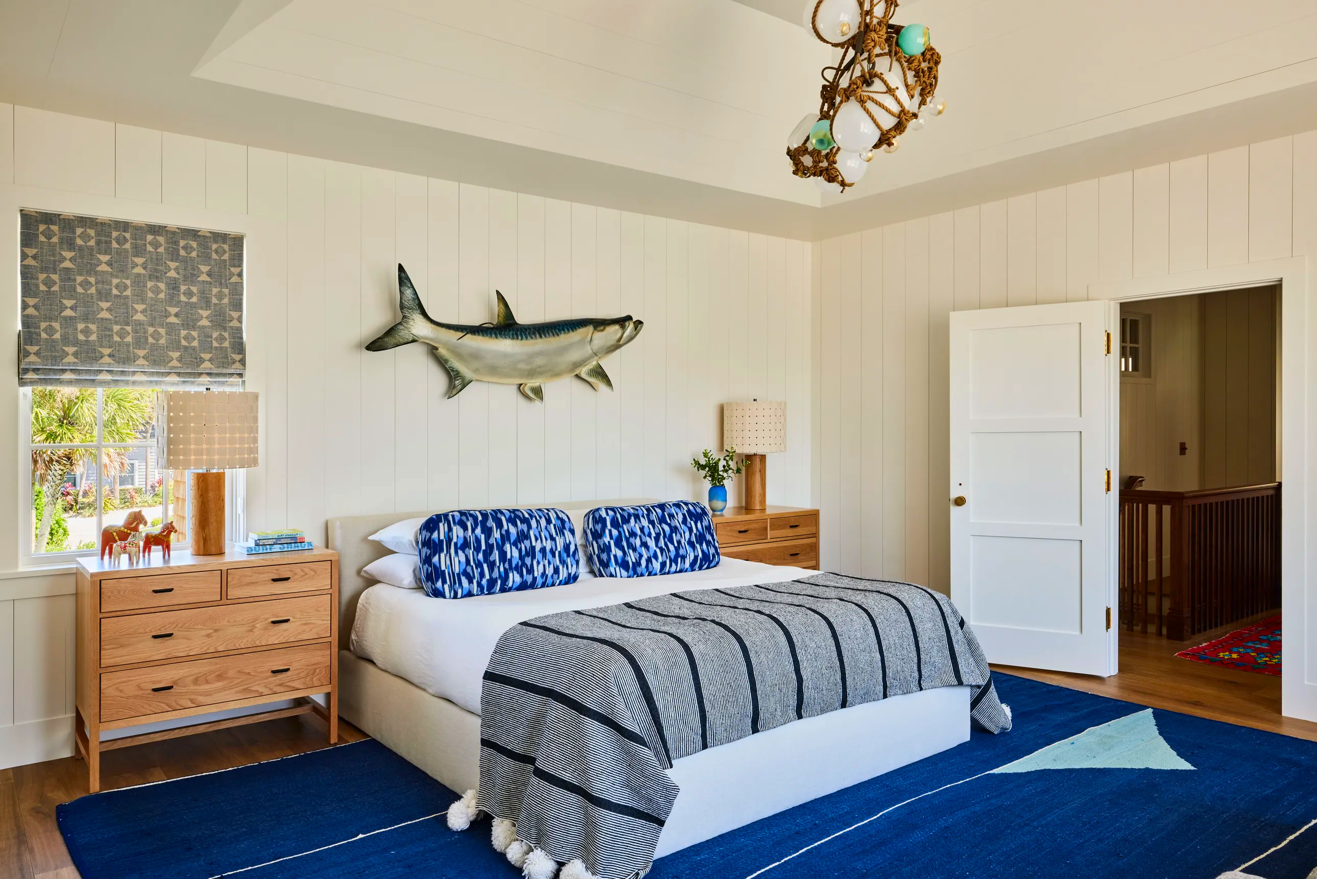 coastal bedroom with fish on the wall