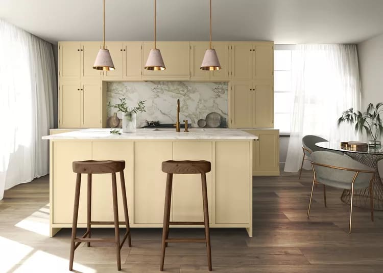 Two wood bar stools in a neutral gold colored kitchen