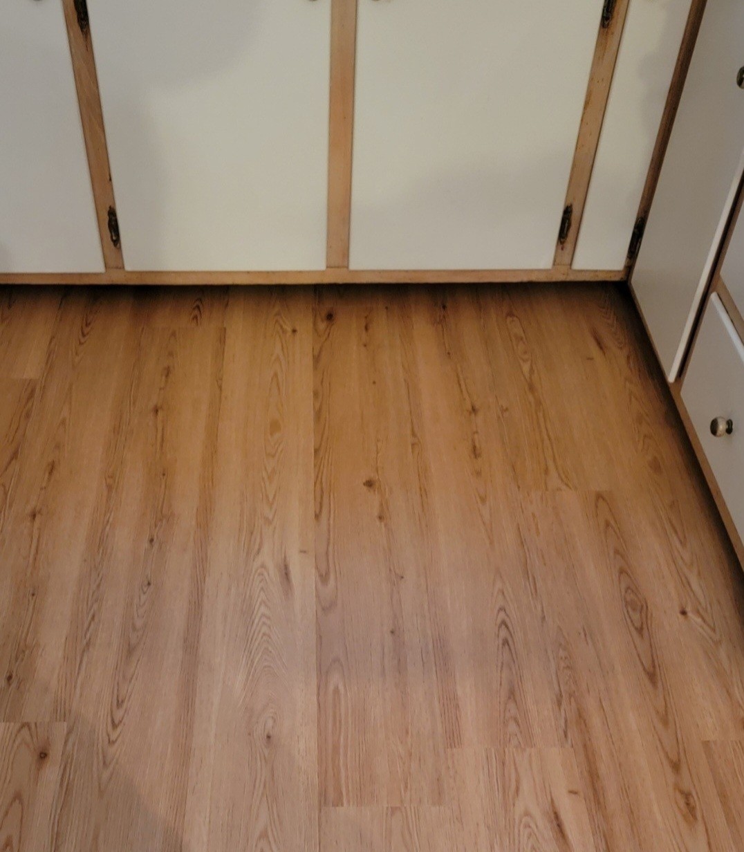 wood look rigid vinyl plank flooring in kitchen