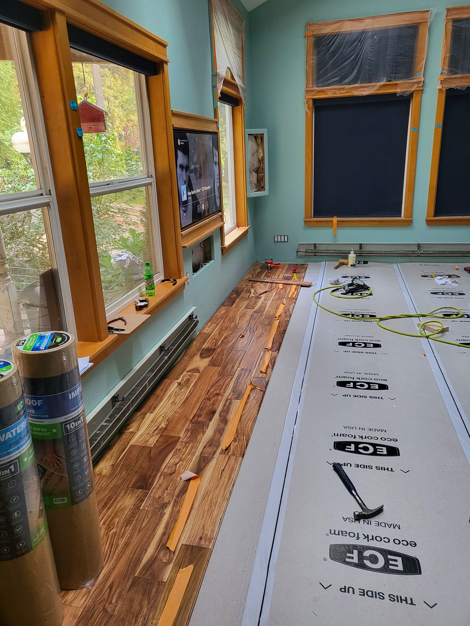 another image during installation of close up of Tobacco Road Acacia hardwood flooring from ll flooring
