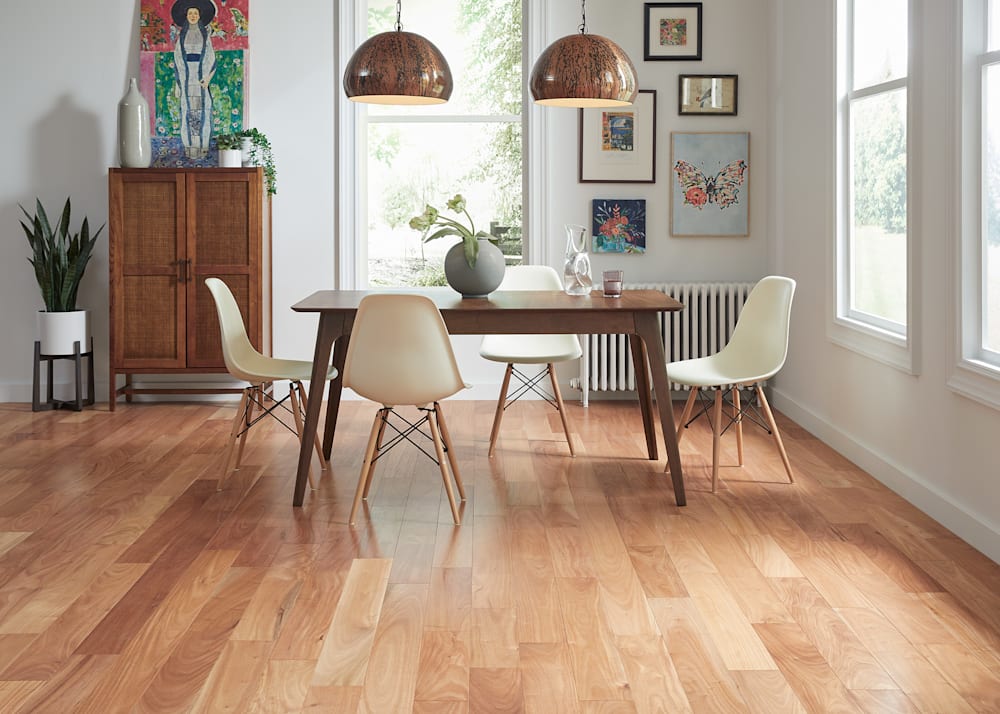 .5 in x 5 in Brioche Distressed Engineered Hardwood Flooring in dining room with dark wood dining table plus white dining chairs plus wood pendant lighting and dark wood and rattan storage cabinet