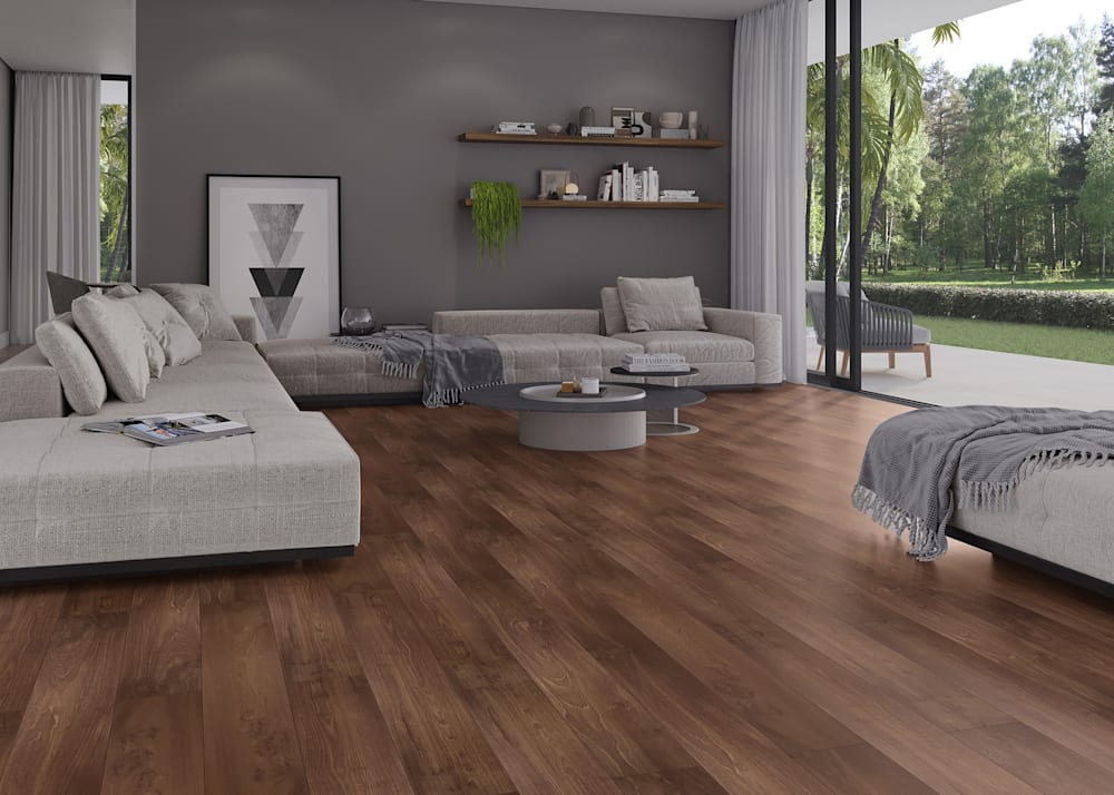12mm Bronzed Oak Waterproof Laminate Flooring in living room with light beige oversized sectional plus floating wood shelves above with green plant and dark gray walls