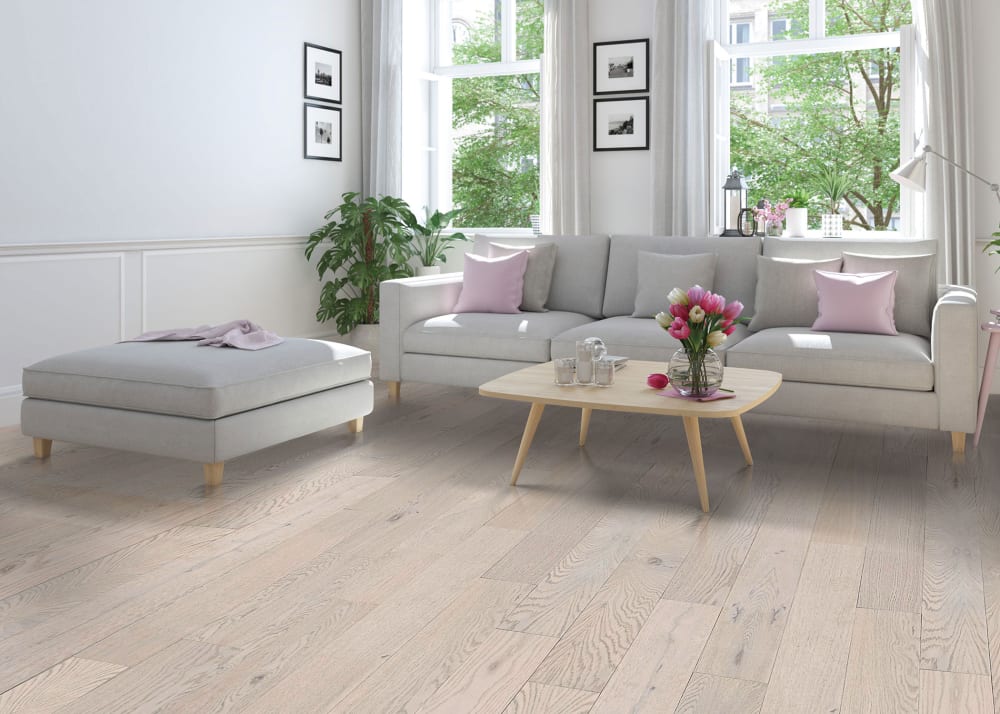 3/8 in x 5 in Warm Ivory Engineered Hardwood Flooring in living room with light gray sofa and pink pillows
