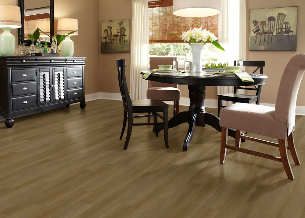 5mm with Pad Woodhill Oak Waterproof Rigid Vinyl Plank Flooring in dining room with dark brown dining table plus beige upholstered chairs and dark brown credenza and peach walls