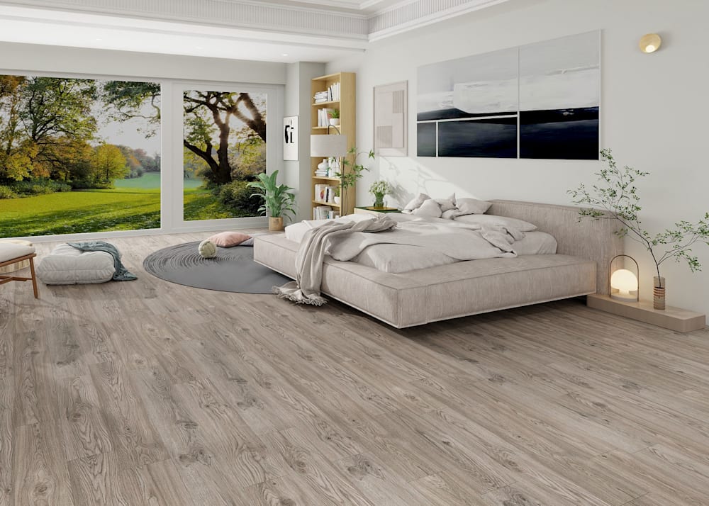 6mm with Pad Portland Oak Waterproof Rigid Vinyl Plank Flooring in bedroom with beige platform bed and abstract art on wall plus small dark gray oval area rug