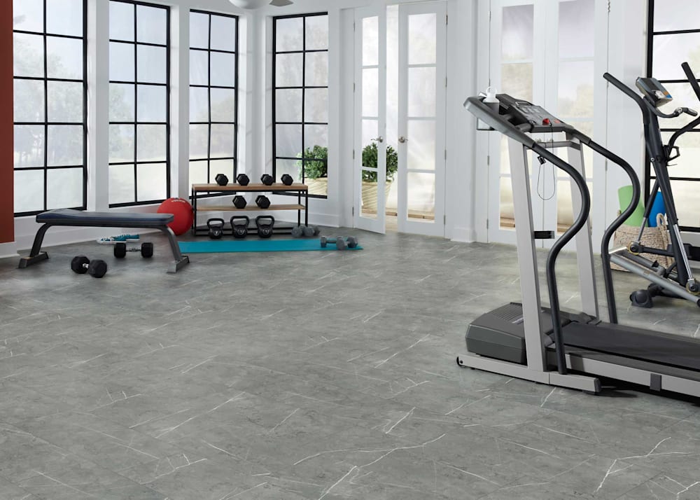 5mm with Pad Grigio Salerno Rigid Vinyl Tile Flooring in home gym with treadmill plus eliptical and free weights