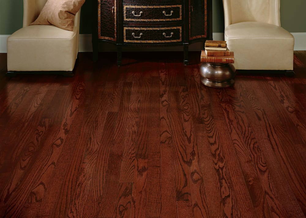 3/4 in x 2.25 in Cherry Oak Solid Hardwood Flooring in living room with beige wing back chairs and dark brown credenza