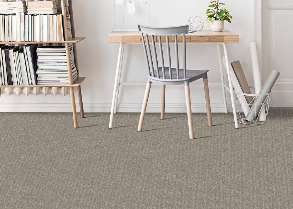Faro Beach Carpet in Pewter in office with light wood desk with white metal legs and medium gray spindle chair with light wood legs