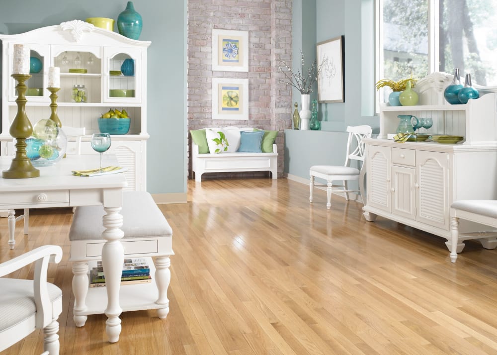 Select White Oak Solid Hardwood Flooring in dining room with white wood furniture throughout with decorative accents pieces in turquoise and green